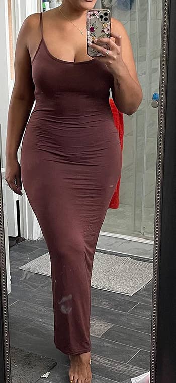 a reviewer wearing the dress. in brown