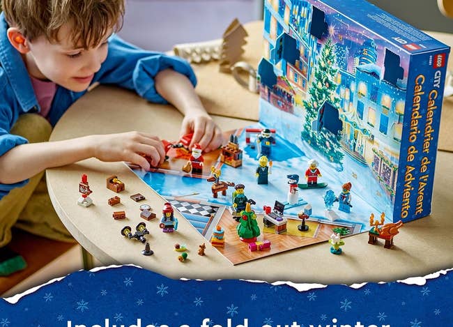 a child playing with a lego city advent calendar
