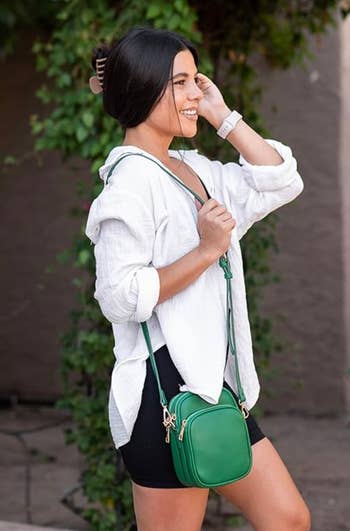 model wearing the green bag