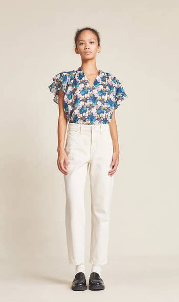 model wearing the blouse with white jeans