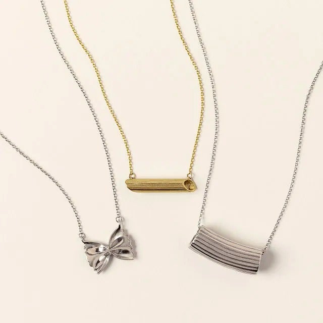 the gold and silver pasta-shaped necklaces