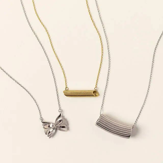 the gold and silver pasta-shaped necklaces