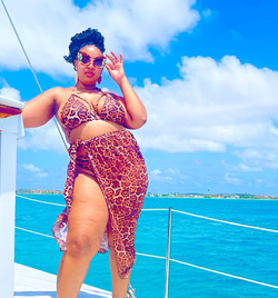 A third reviewer posing in leopard print three-piece set