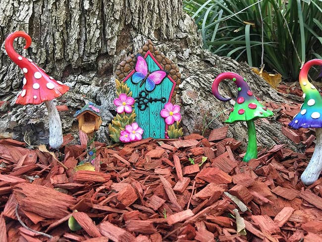 image of colorful mushroom spikes placed at the bottom of a tree