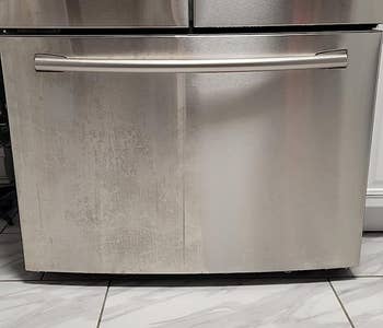 a reviewer's stainless steel freezer half cleaned