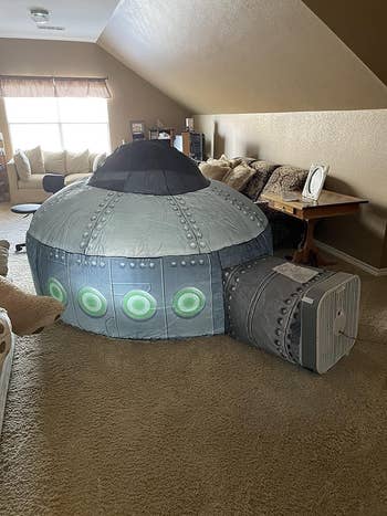 reviewer's air fort that looks like a spaceship connected to a floor fan