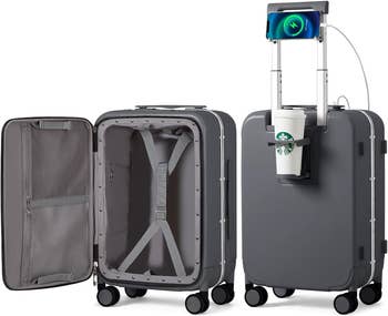 Three-piece smart luggage set with integrated tech features, open to show compartments