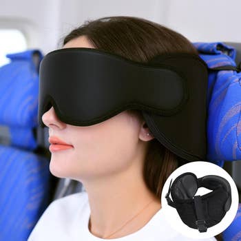 model strapped into an airplane seat with an eye mask over their face 