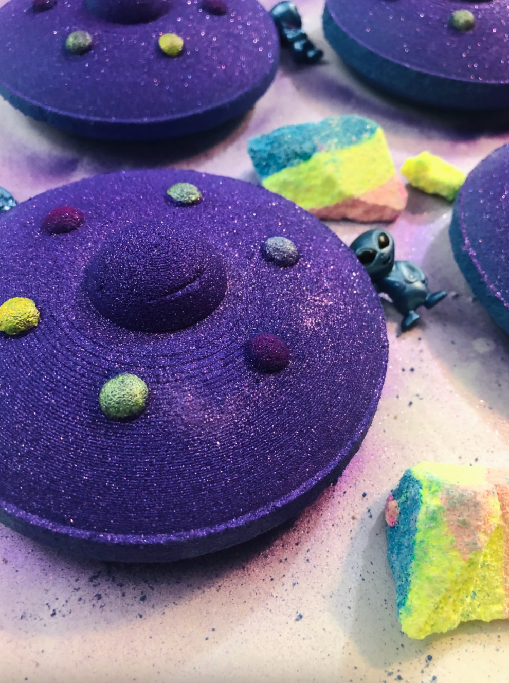 bath weaponry  surrounded by rainbow chunks and alien 