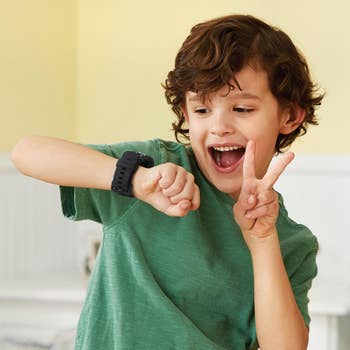 child model smiling and taking a selfie on the watch