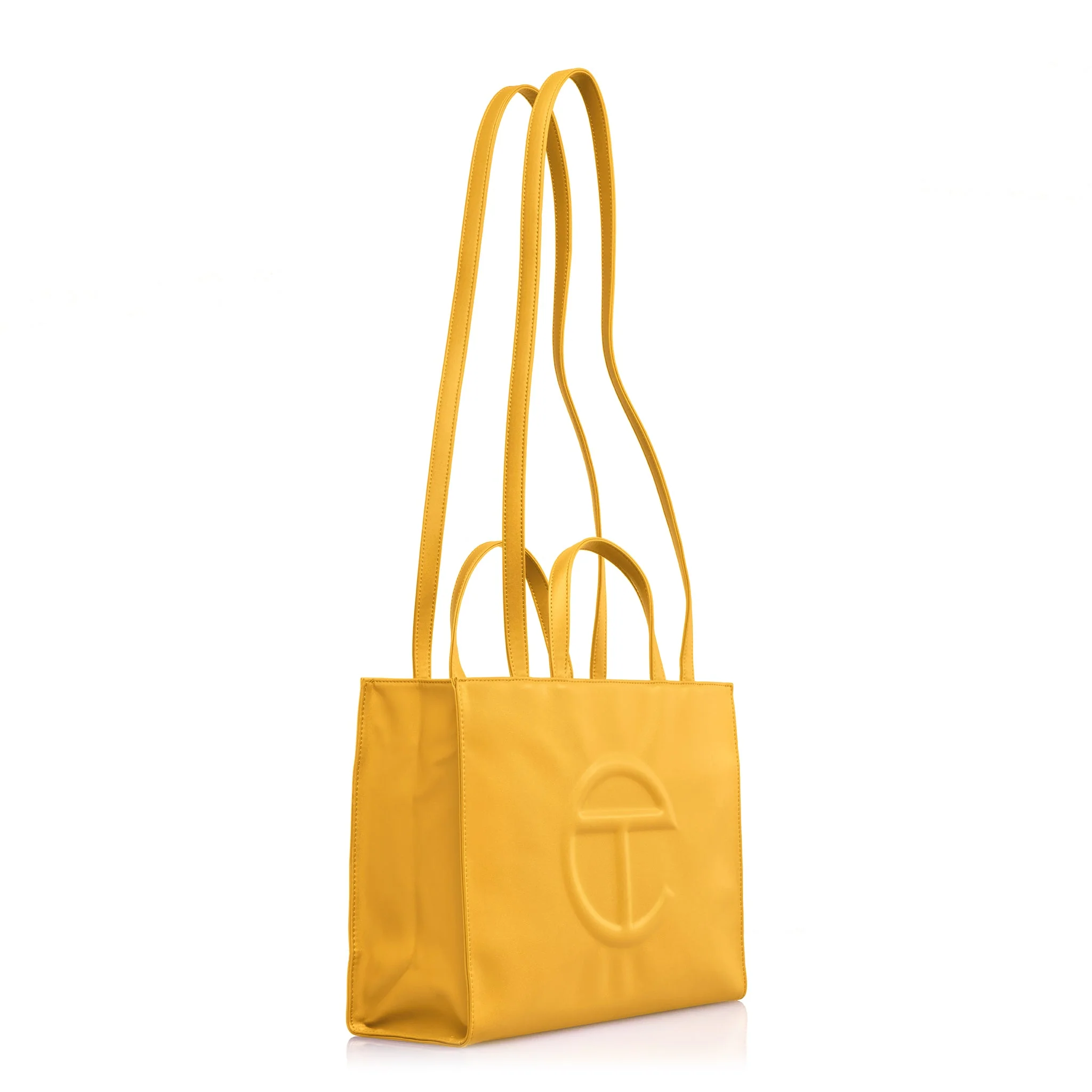 Telfar buying  container  with treble  handles and embossed logo, featured successful  a buying  article