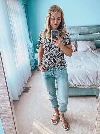 Reviewer is wearing the same top with light blue denim jeans
