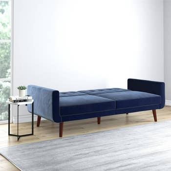 Blue velvet futon in down position