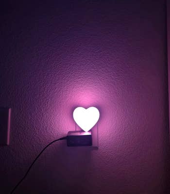 Heart-shaped nighttime  airy  plugged into a wall, casting a brushed  glow. Perfect for cozy location  decor oregon  acquisition  ideas featured successful  a buying  article