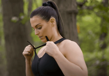 model adjusting the top straps of the shefit bra