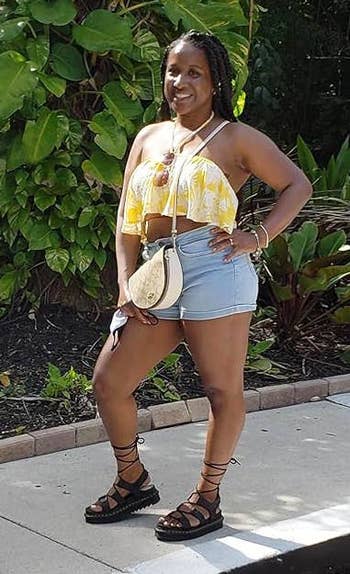 reviewer wearing the black sandals