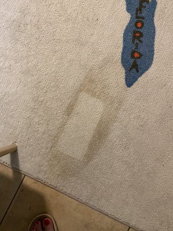 Reviewer photo of a stain with a rectangle part of it completely clean 