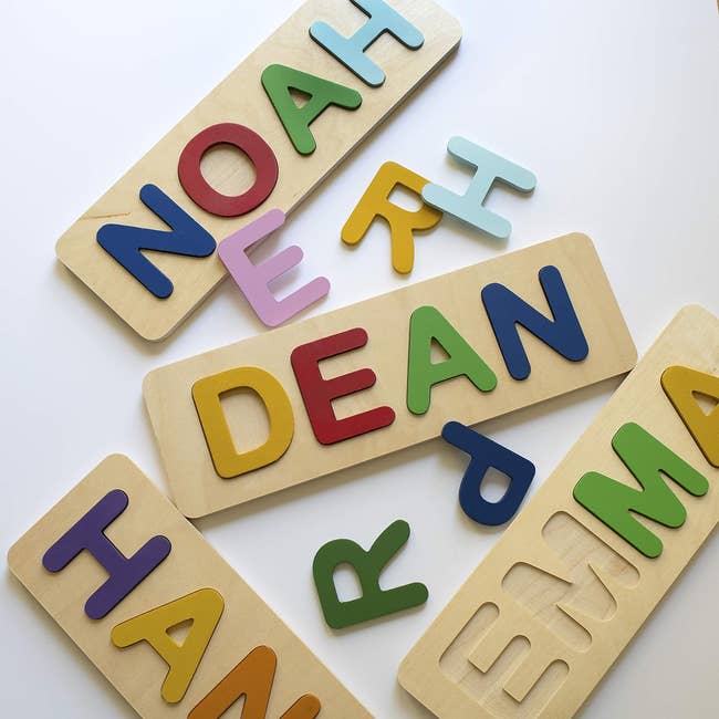 Personalized wooden name puzzles with various letters for children