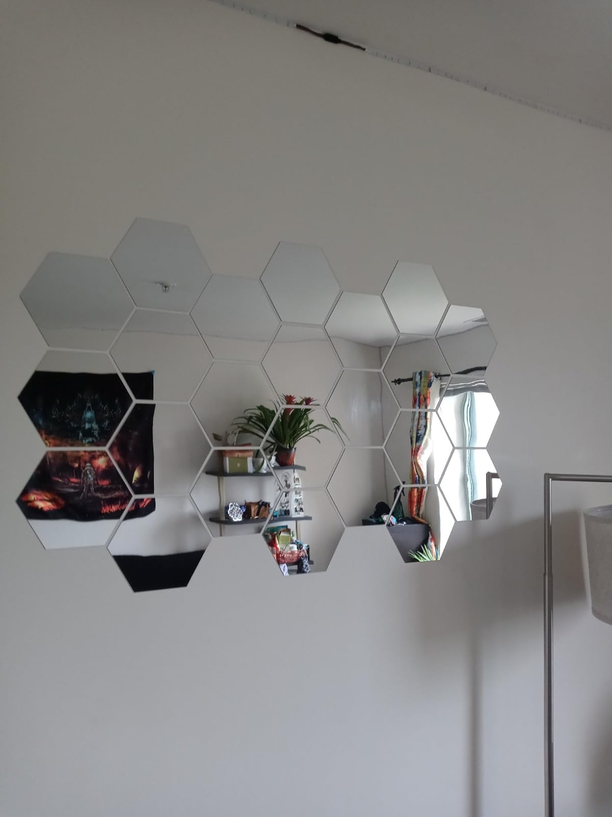 A wall with hexagonal mirror panels