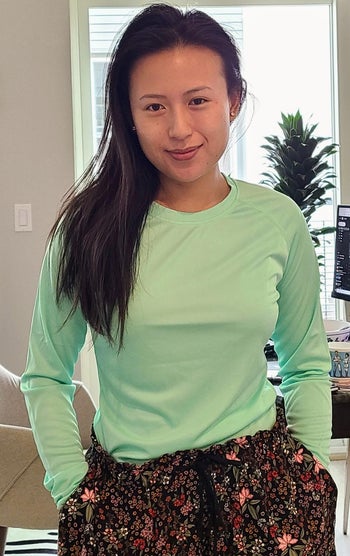 reviewer in solid-color mint tee 