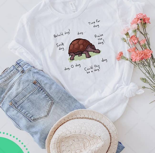 a white t-shirt with a dog/turtle meme on it from elden ring