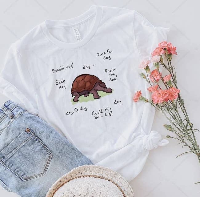 a white t-shirt with a dog/turtle meme on it from elden ring