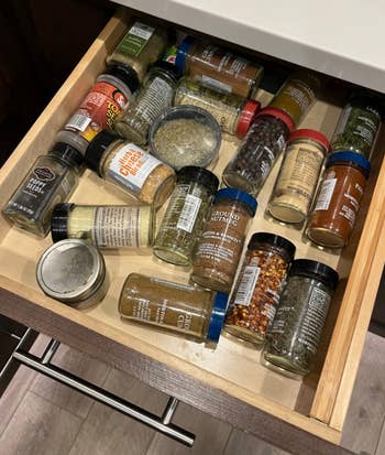 reviewer before photo showing various spices scattered in a drawer