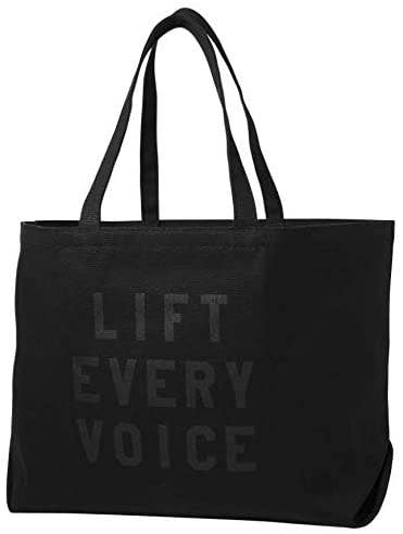 black tote with subtle message on it that says 