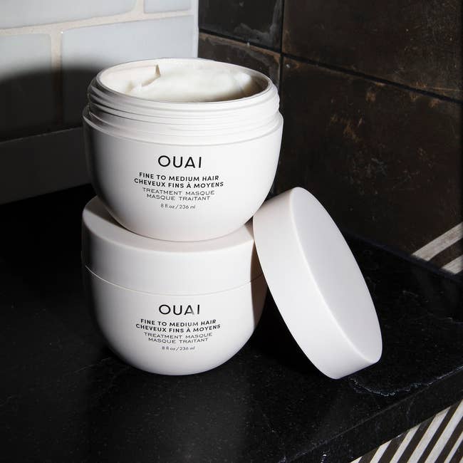 two jars of the hair treatment mask
