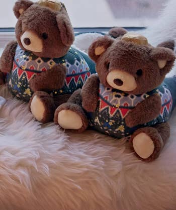 the two bear slippers in Christmas sweaters