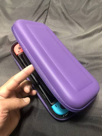 a reviewer's switch inside a purple carrying case