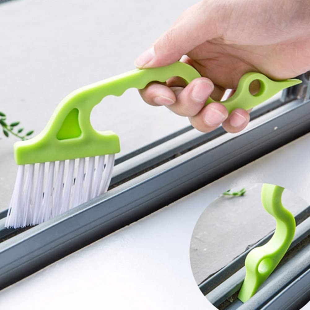 a thin brush with a green handle