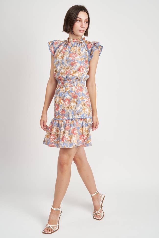 model in floral print mini dress