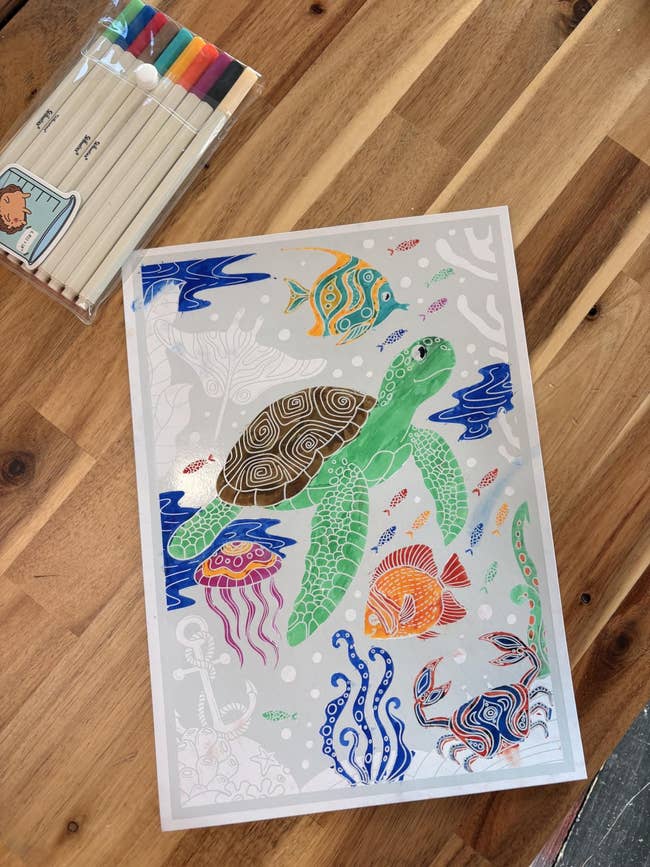 Colorful turtle-themed coloring expanse  connected  a woody  table, accompanied by a battalion  of vibrant markers