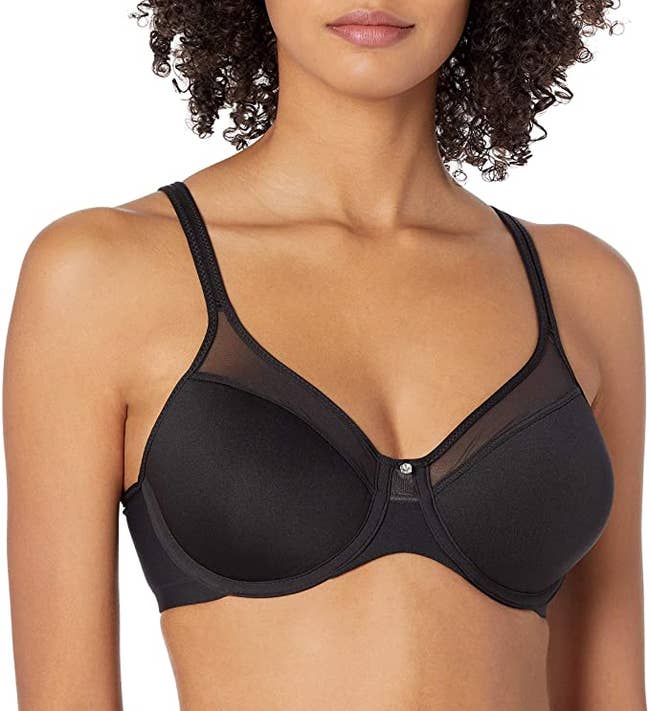 model wearing black bra with mesh detailing