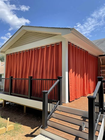 The curtains in red covering a reviewer's deck