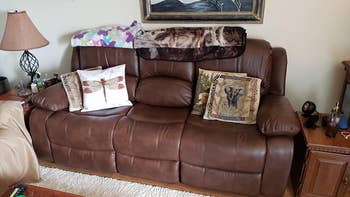 reviewer photo of brown leather three-seater sofa