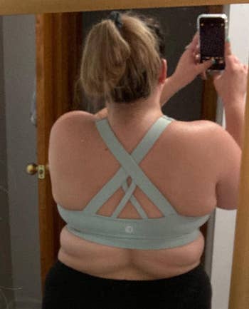 reviewer showing the back of the sport bra
