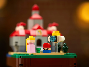 lego figures of princess peach and mario with a castle in the back