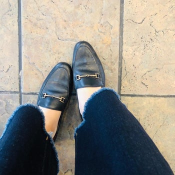 Reviewer wearing the loafers in black