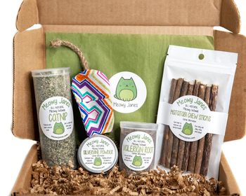 a box of catnip alternatives, including valerian, silvervine powder, matatabi sticks, home grown catnip, and a refillable toy