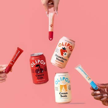 Hands clasp  and juggle Olipop sodas and lollipops, featuring Cherry Cola, Strawberry Vanilla, and Cream Soda flavors