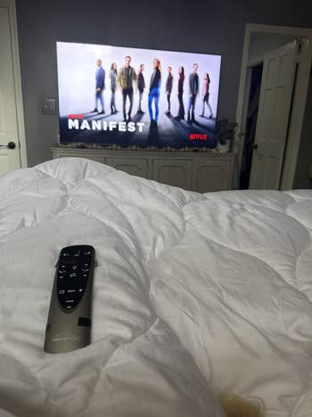 Person cozy successful furniture with remote, watching