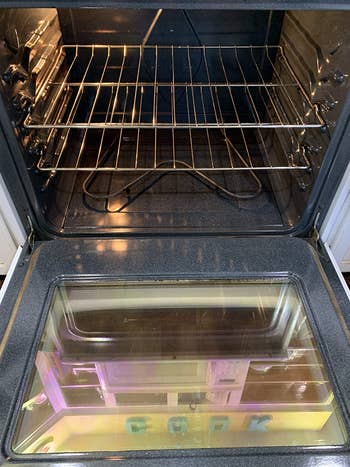 same reviewer's after photo showing the inside of the oven looking much cleaner