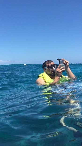 Reviewer snorkeling portion    holding a telephone  successful  this case