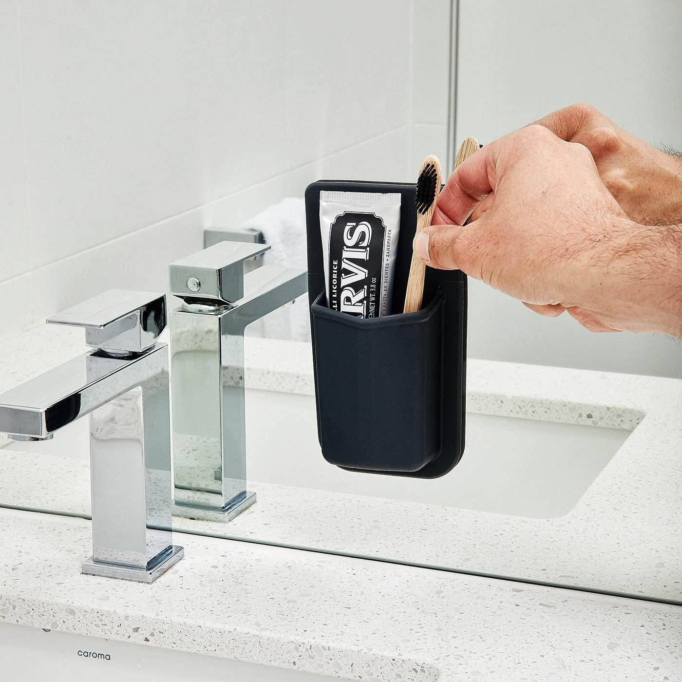 toothbrush holder stuck on a mirror