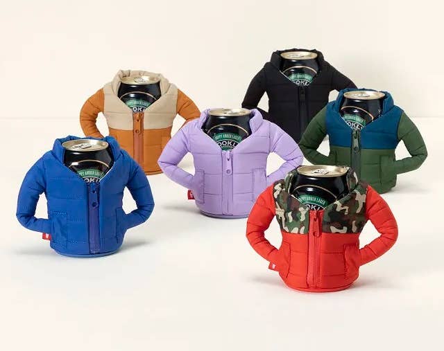 six beer cans, each wearing a different colored puffer coat cozy