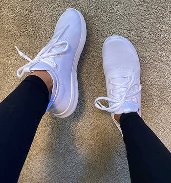 reviewer wearing the white sneakers