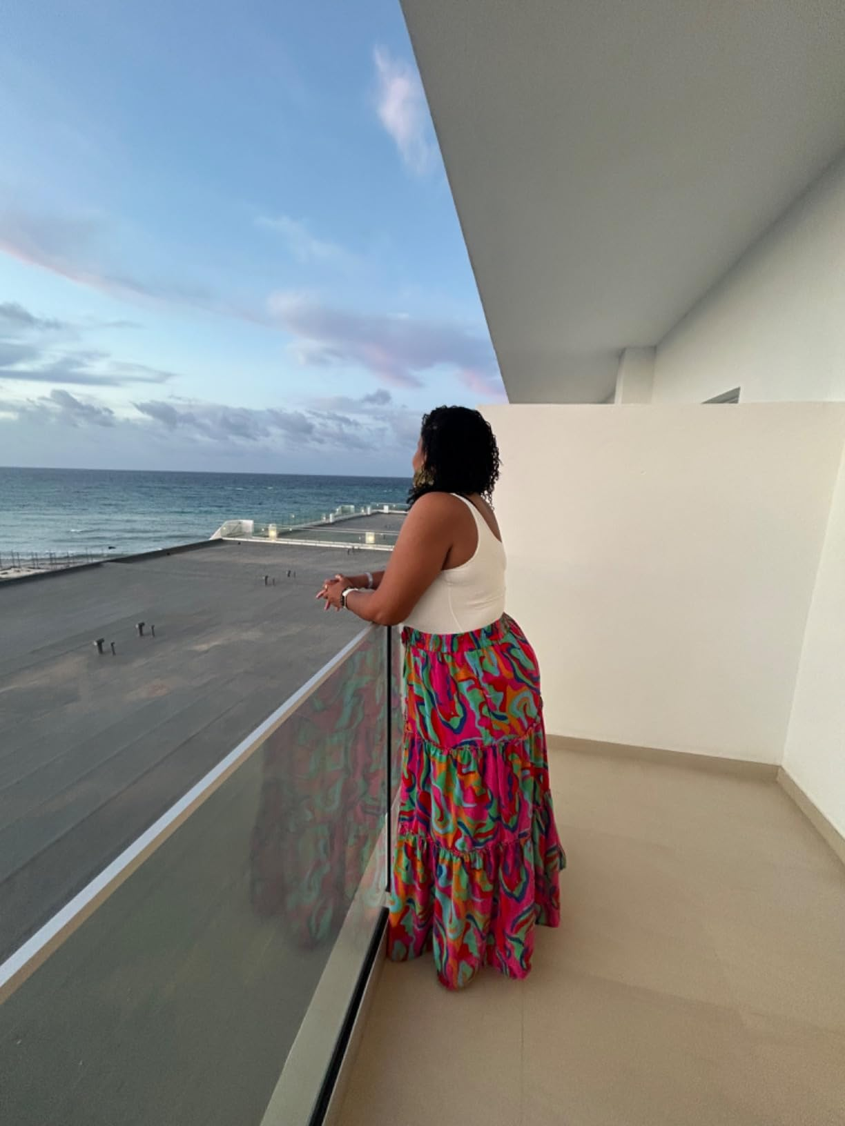 reviewer lasting  connected  a balcony with the water  presumption    successful  the inheritance  wearing the multicolor skirt