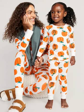 The same model with a child wearing matching pajama sets